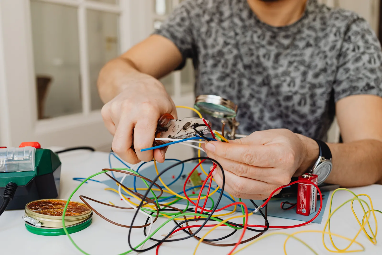 Stripping and sorting conductors at the bench, for electrician in Calgary