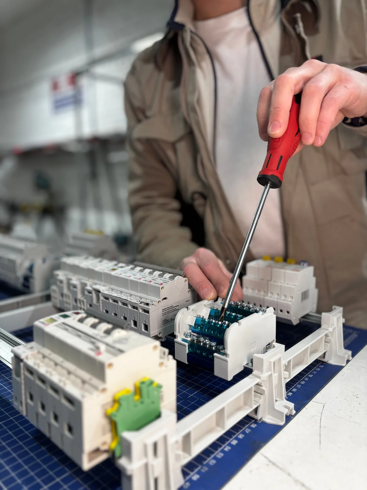 Breakers assembled on a DIN rail before installation, for licensed electrician in Calgary