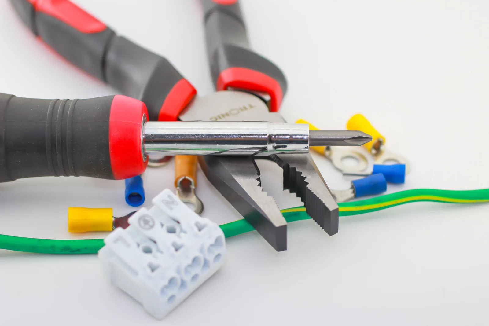 Pliers, a screwdriver, ferrules and a connector block, for electrician in Calgary