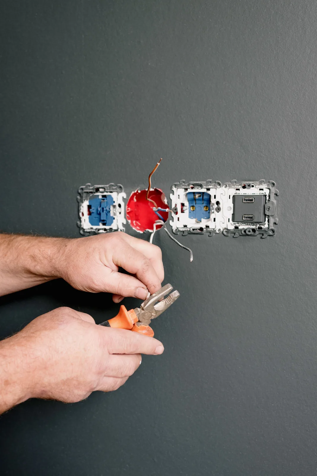 Wiring an outlet box into a finished wall, for code violation in Calgary