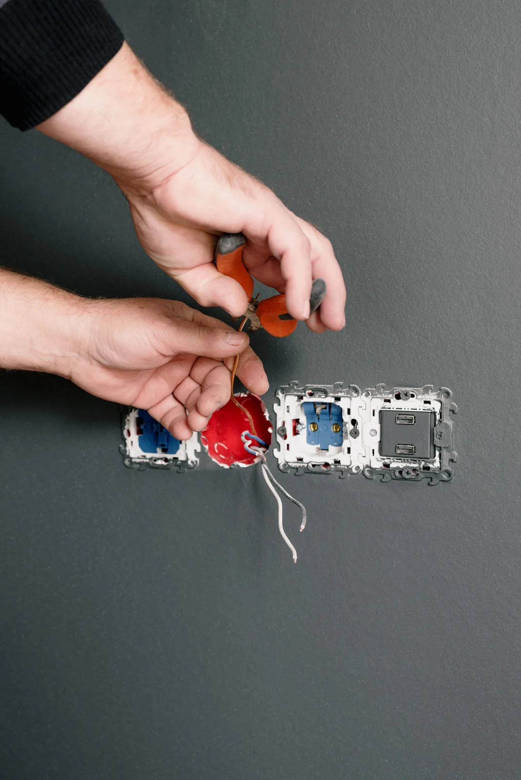 Stripping conductors at an outlet box, for outlet installation in Calgary