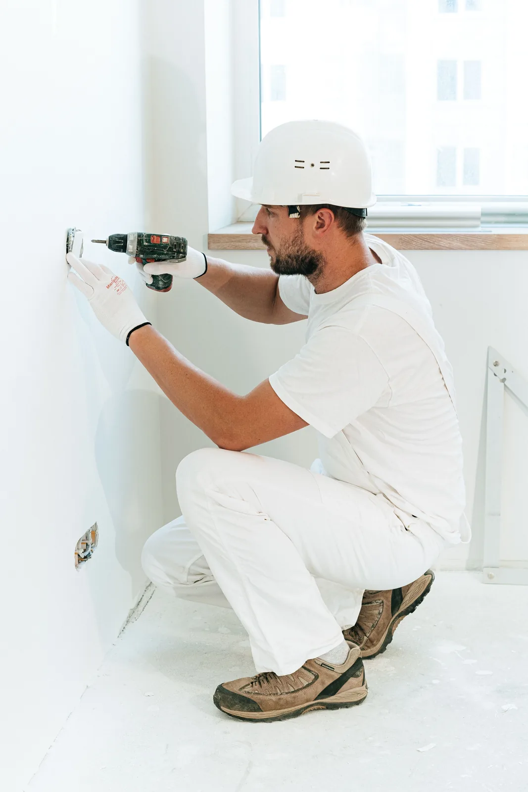 Fixing a socket into a finished wall, for electrician in Calgary